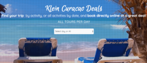 Two empty blue beach chairs face turquoise ocean waves on Curacao’s sandy beach under a clear blue sky. Palm fronds frame the scene. Overlaid white text promotes Klein Curacao tour deals, with a dropdown menu to select tour days or all days.
